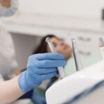 female-patient-having-procedure-done-dentist-min